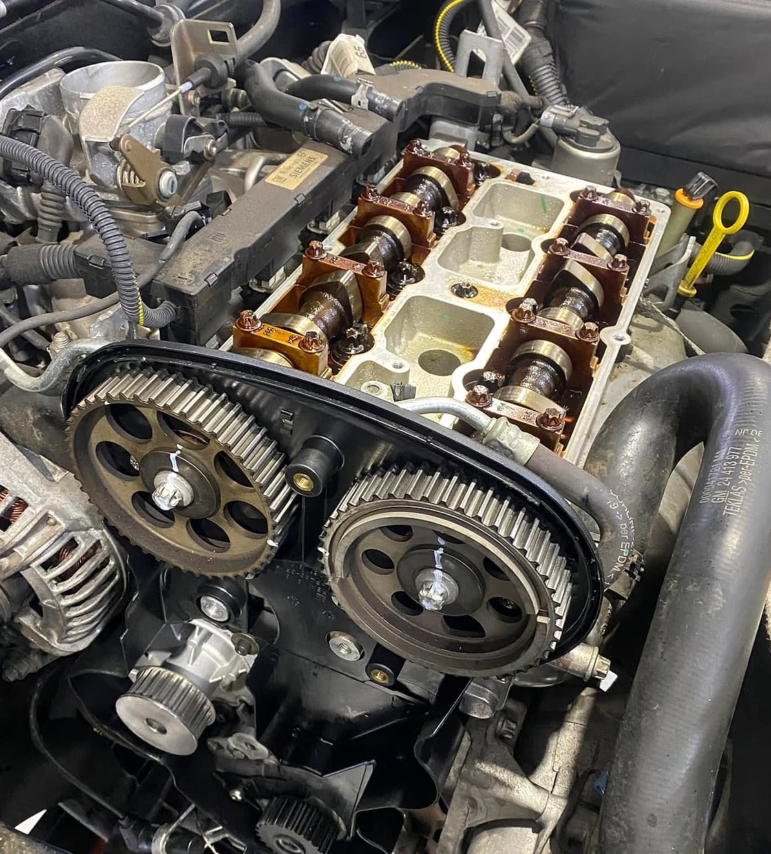 A timing belt and twin-cam engine being worked on at RC Automotive Solutions
