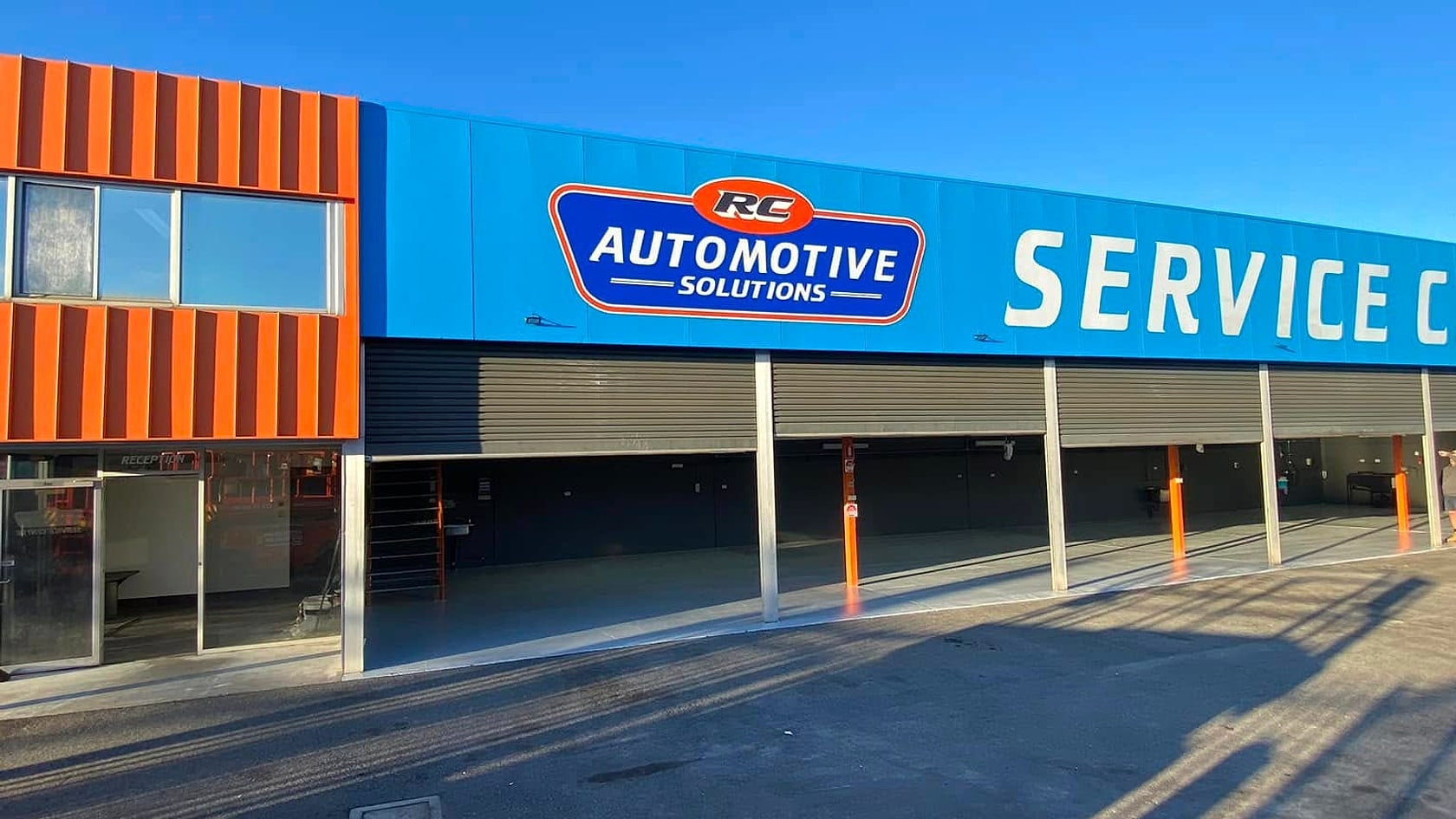 The RC Automotive Solutions service centre frontage with open service bays