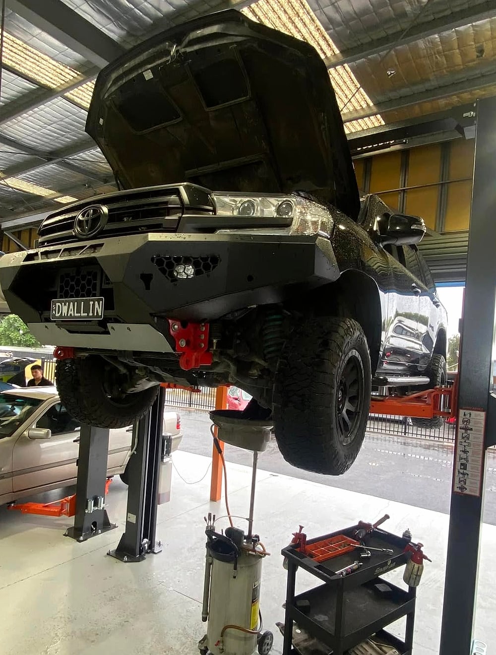 A four wheel drive up on the hoist at RC Automotive Solutions
