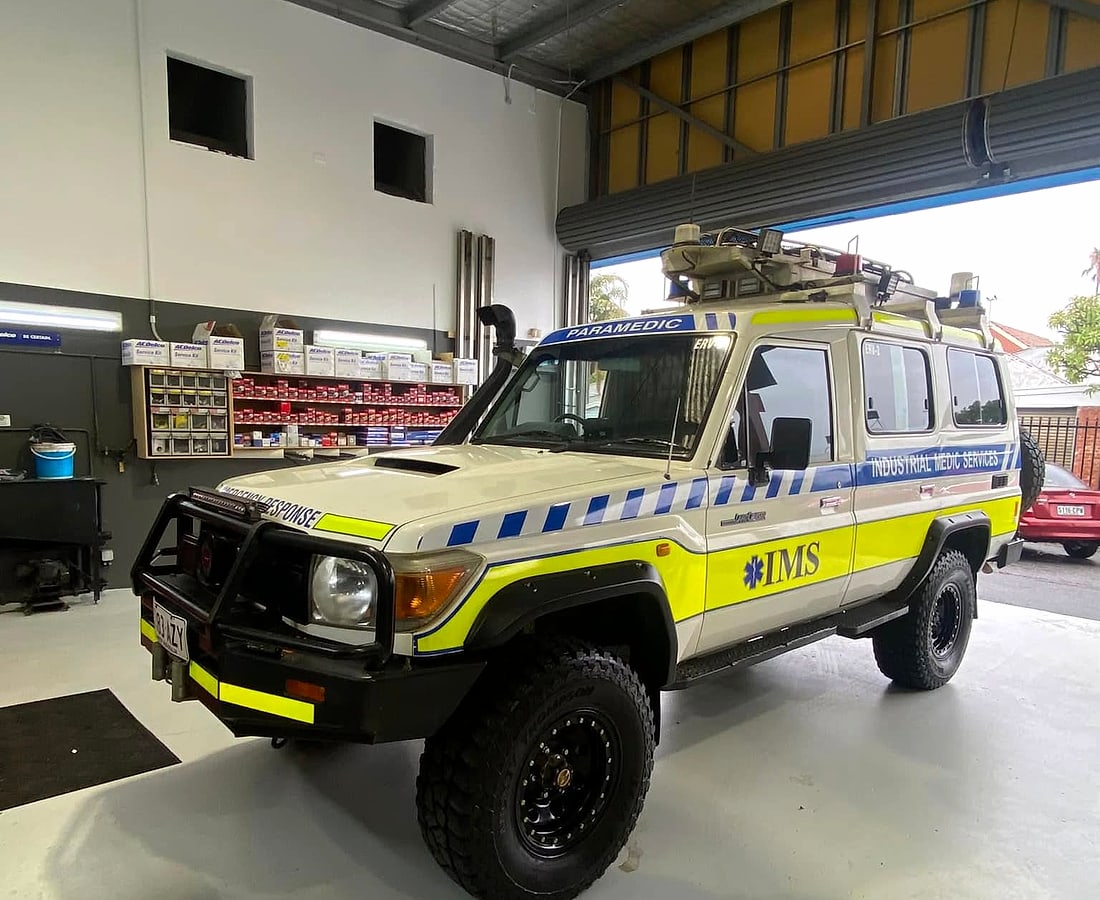 A fleet four wheel drive in for service beside the parts shelf